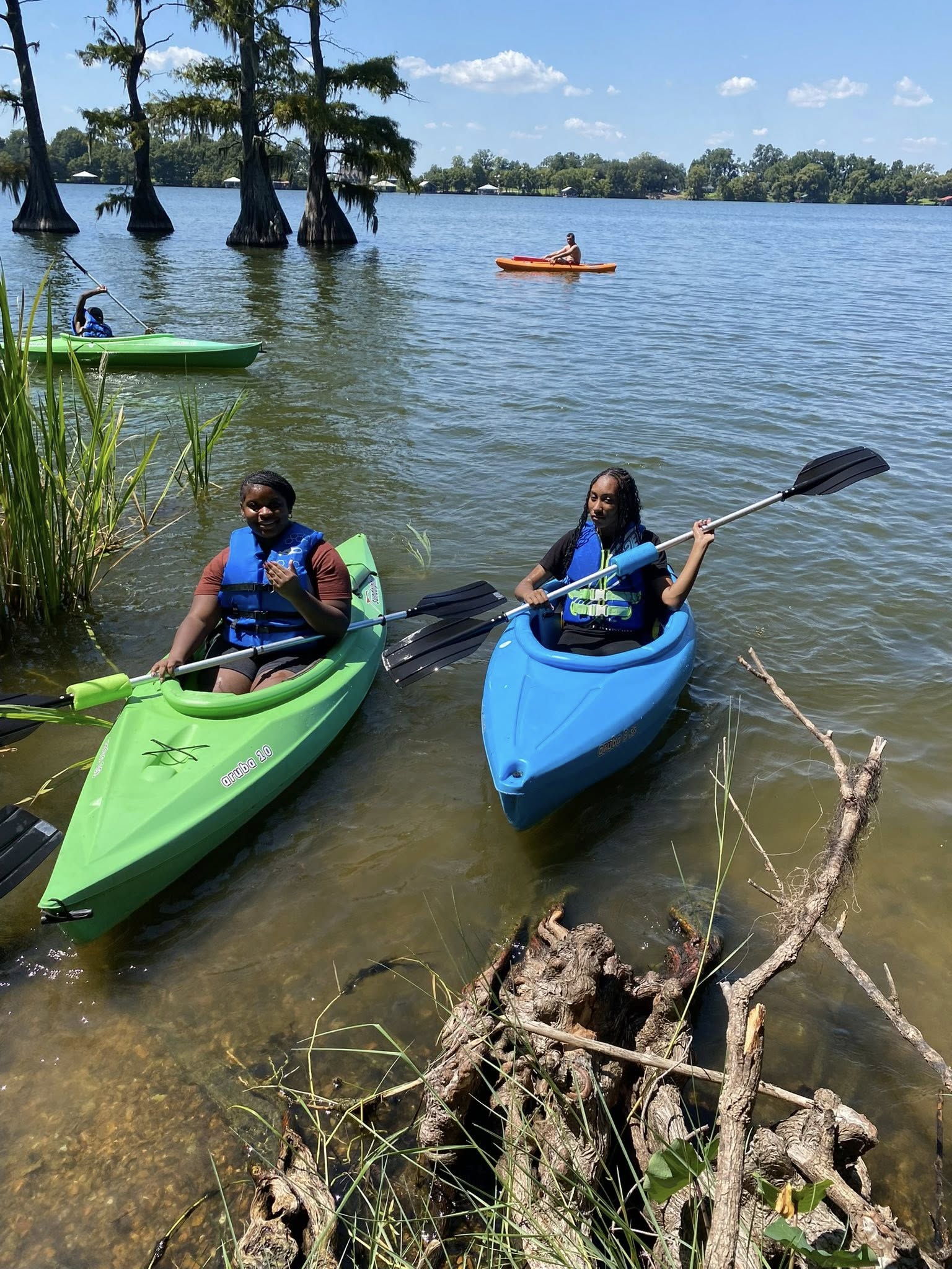 Two girls in kayaks.